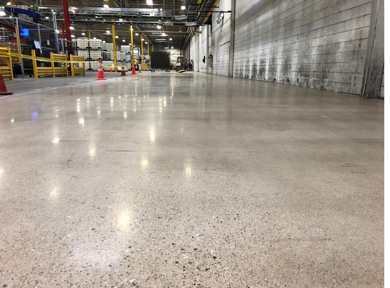 Sealed polished concrete floor in a distribution aisle