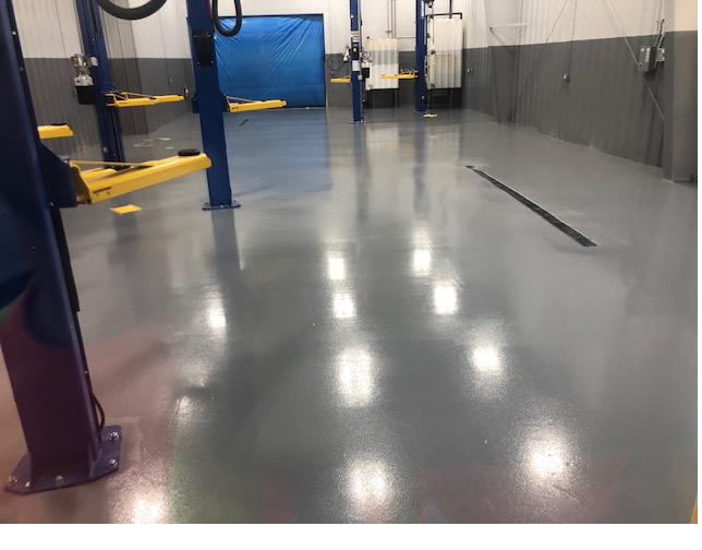 Epoxy coated concrete floor in a service bay